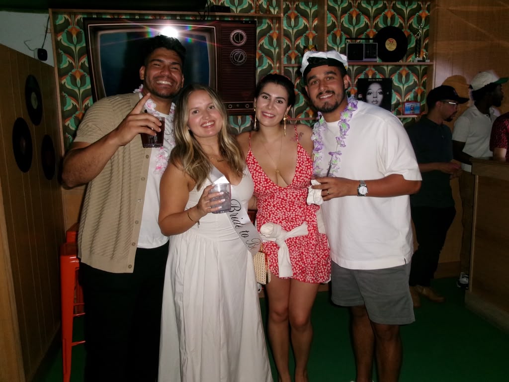 The bride-to-be with friends at the retro bar